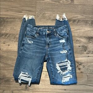 American Eagle Outfitters Women's Distressed Blue Jeans with chewed hem